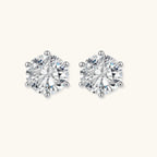 Close-up of round brilliant-cut moissanite stud earrings in 6-prong sterling silver settings showing exceptional sparkle