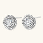 Double halo sterling silver stud earrings with brilliant round moissanite center stones and pavé crystal accents