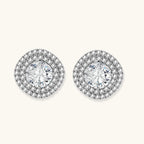 Double halo sterling silver stud earrings with brilliant round moissanite center stones and pavé crystal accents