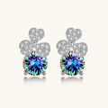 Sterling silver stud earrings with four-leaf clover design featuring small crystals above round moissanite stones