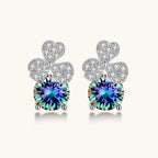 Sterling silver stud earrings with four-leaf clover design featuring small crystals above round moissanite stones