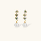Gold-plated jewelry set with green cubic zirconia floral motifs, featuring matching necklace and pearl drop earrings