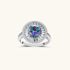 Close-up of sterling silver halo ring with round rainbow moissanite center stone surrounded by baguette-cut stones