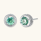 Round green moissanite stud earrings in sterling silver halo settings with brilliant sparkle on white background.