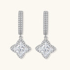 Sterling silver huggie hoops with geometric diamond-shaped moissanite dangles featuring pavé crystal details