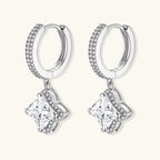 Sterling silver huggie hoops with geometric diamond-shaped moissanite dangles featuring pavé crystal details