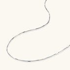 Delicate platinum-plated sterling silver necklace with alternating textured cubic links and smooth chain sections.